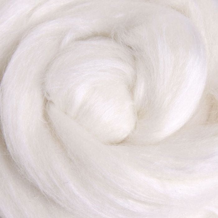 close up of a swirl of brilliant white merino and silk fibre