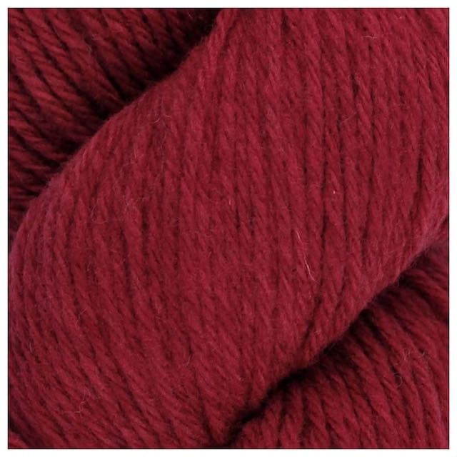 Santa Cruz Saffron is a reddish yarn with lighter undertones. 
