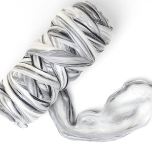 Marbled black and white wool blend fibre on a white background